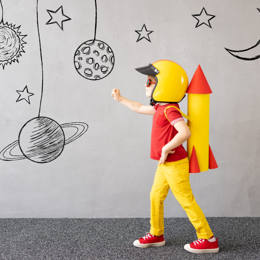 A child in a rocket costume, representing growth